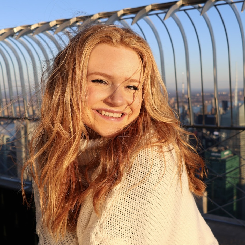 A person smiling at the camera  AI-generated content may be incorrect.